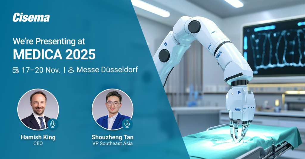 The image is a promotional banner for Cisema’s participation in Medica 2025. The left side features a teal-blue background with white and bold text reading “Cisema” at the top followed by “We’re Presenting at Medica 2025.” Below that, icons and text show the event dates “17–20 Nov.” and location “Messe Düsseldorf.” At the bottom left are circular photos of two speakers. The first is Hamish King, labeled “CEO,” wearing a dark suit, white shirt, and tie. The second is Shouzheng Tan, labeled “VP Southeast Asia,” wearing glasses and a blue blazer over a white shirt. Both photos have small microphone icons indicating they will be presenting. The right side of the image shows a robotic surgical arm in a medical operating room, performing or simulating a procedure on a covered table with a surgical drape. A monitor in the background displays medical imaging. The overall design combines technology and healthcare themes to highlight Cisema’s presence at Medica 2025.